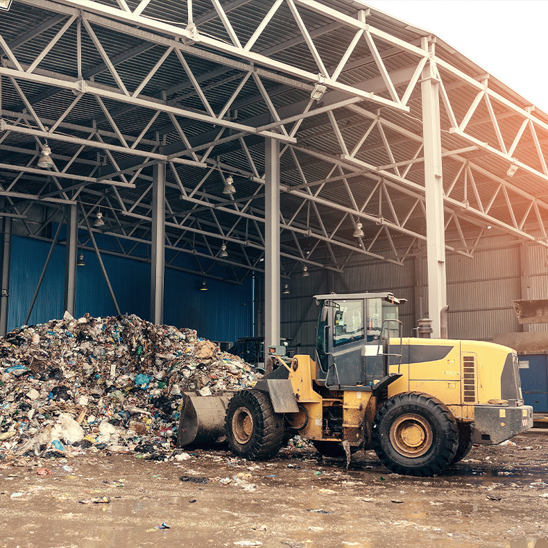 Bulldozer clearing waste